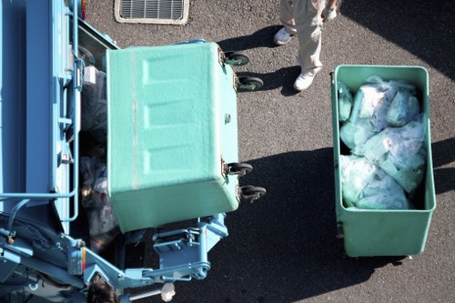 Workers wearing PPE during removal of household items